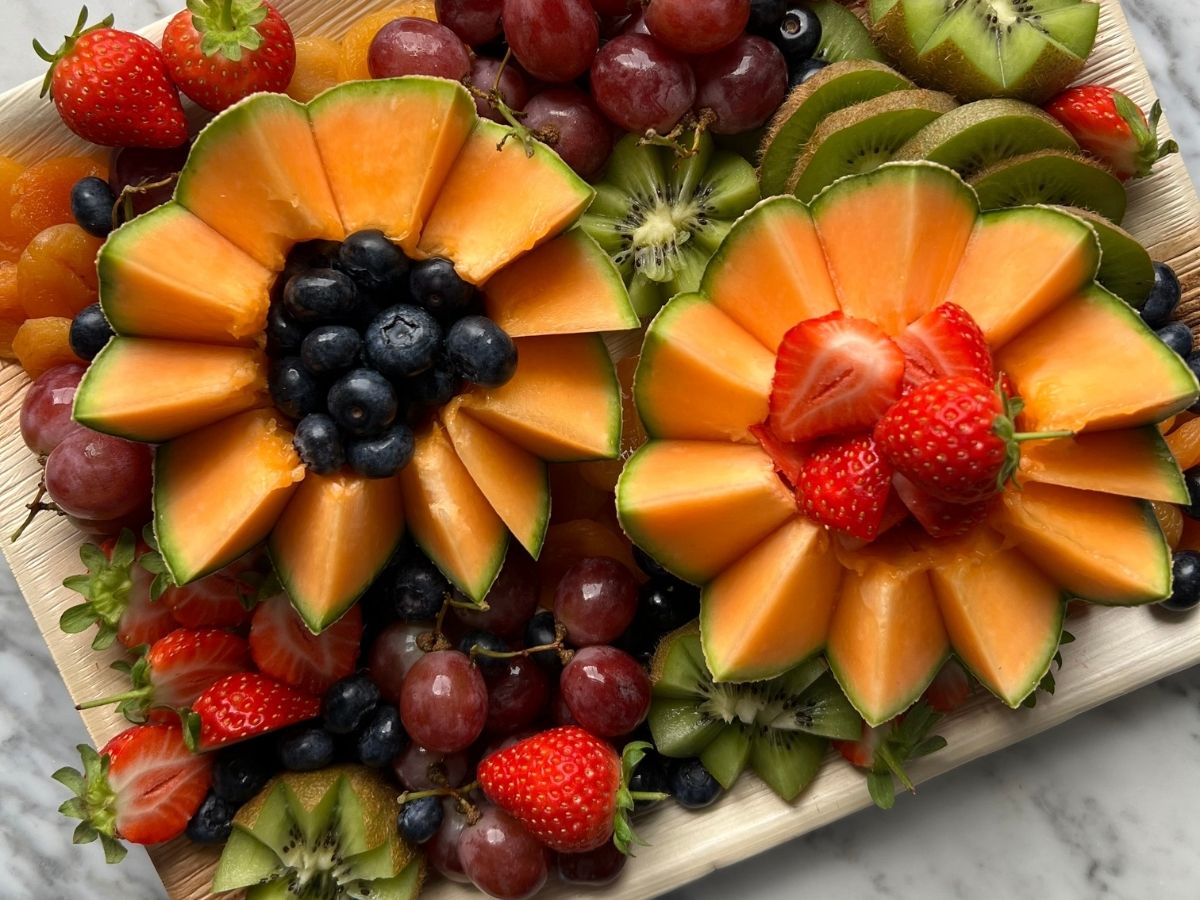 The Fruity One grazing board packed with colourful fresh fruit